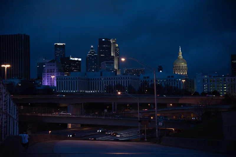 Atlanta: A captivating view of Atlanta's skyline with illuminated buildings and highways at night.