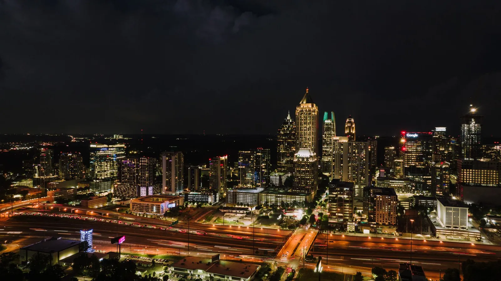 Atlanta: Discover the vibrant Atlanta skyline at night, showcasing the city's illuminated skyscrapers and bustling streets.