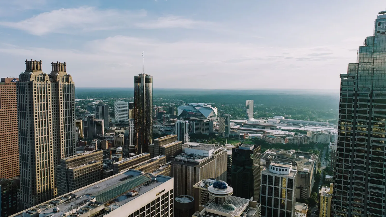 Atlanta: Breathtaking aerial view of Atlanta's skyline showcasing iconic buildings under a clear sky.