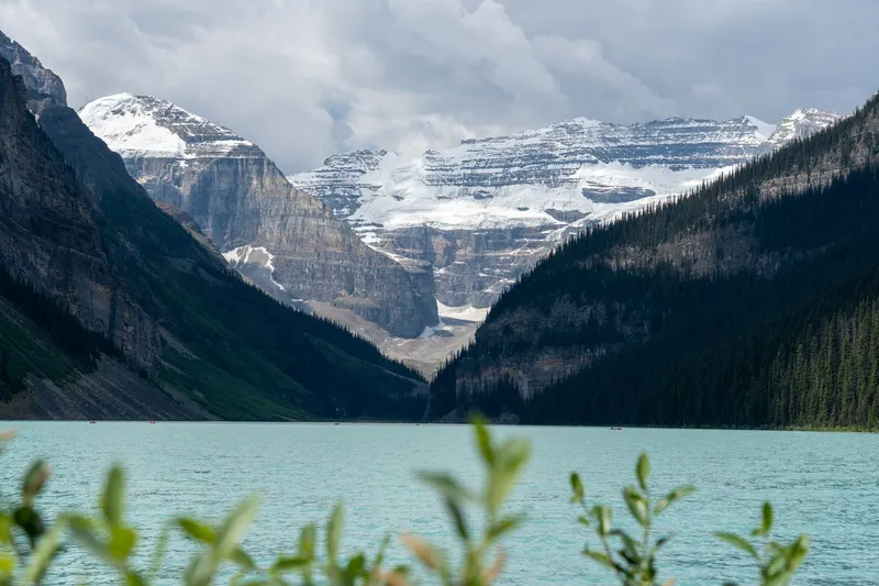 Banff and Lake Louise: Stunning view of Lake Louise with mountains and glacier reflections in Banff National Park, Alberta, Canada.