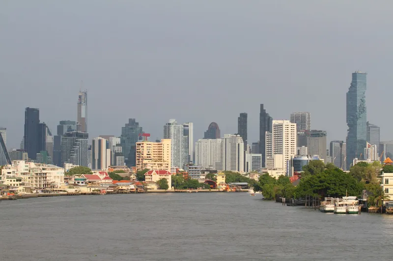 Bangkok: Bangkok's skyline with modern skyscrapers along the Chao Phraya River.