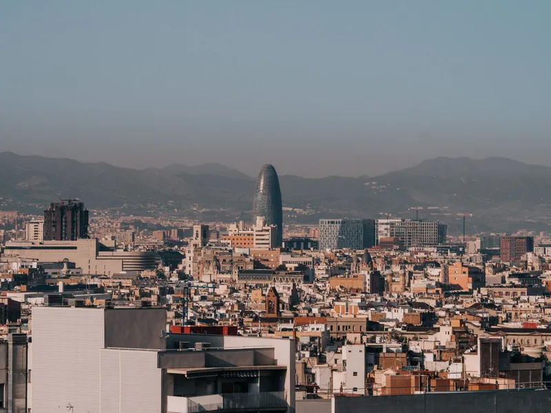 Barcelona: A panoramic view of Barcelona's skyline with Torre Glòries during a clear morning.