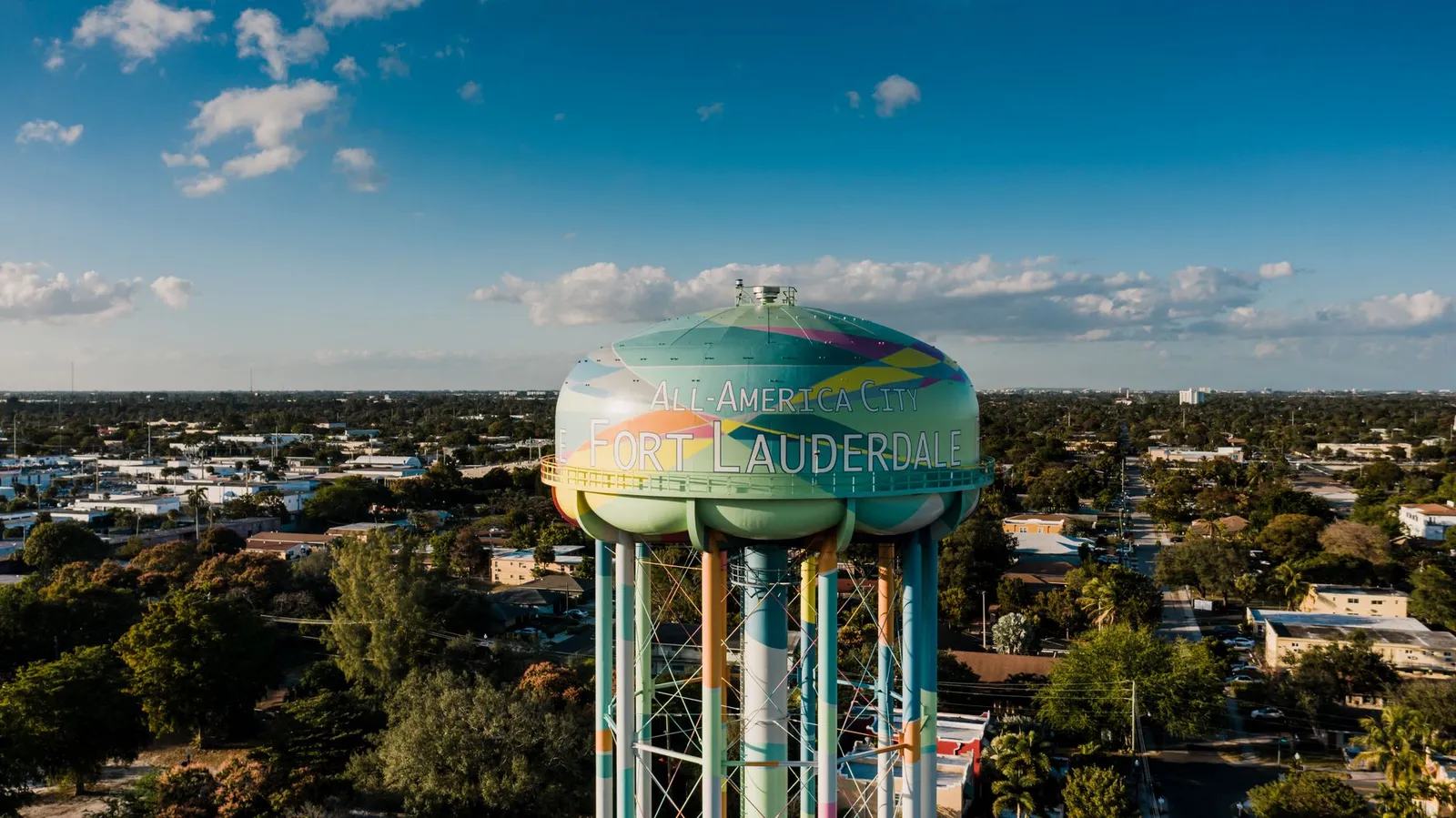 Fort Lauderdale: Picturesque drone view of colorful elevated water tower located against cloudy blue sky in Fort Lauderdale