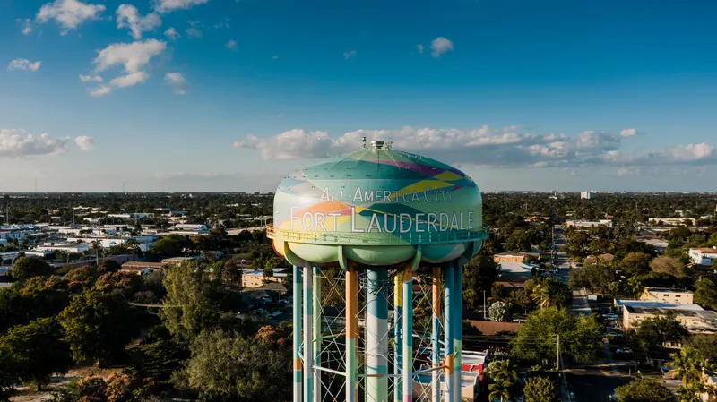 Fort Lauderdale: Picturesque drone view of colorful elevated water tower located against cloudy blue sky in Fort Lauderdale