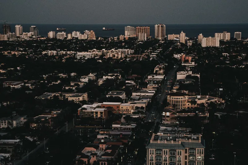 Fort Lauderdale: Stunning aerial cityscape of Fort Lauderdale, highlighting the urban skyline and ocean view during twilight.
