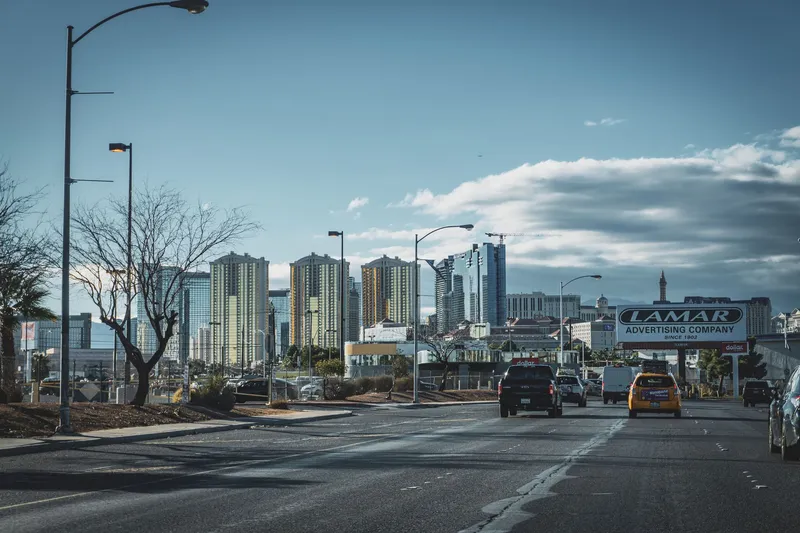 Las Vegas: Dynamic view of Las Vegas skyline with bustling street traffic and modern skyscrapers.