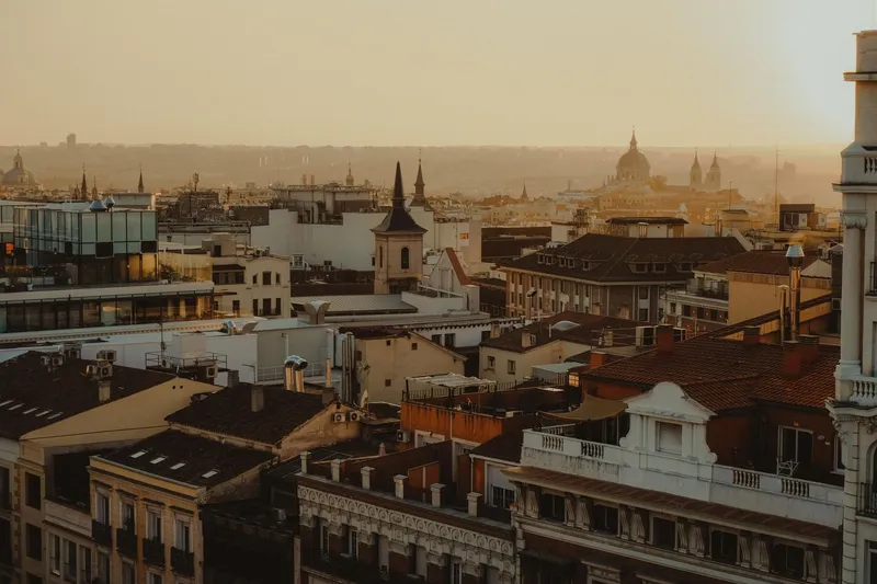 Madrid: Scenic panorama of Madrid's rooftops and skyline at sunset.