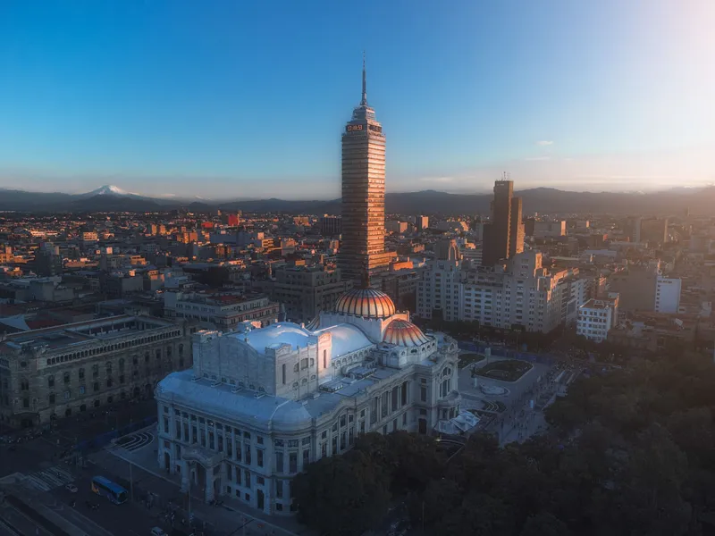 Mexico City: Skyline featuring Torre Latinoamericana in Mexico City during sunset, showcasing urban architecture.