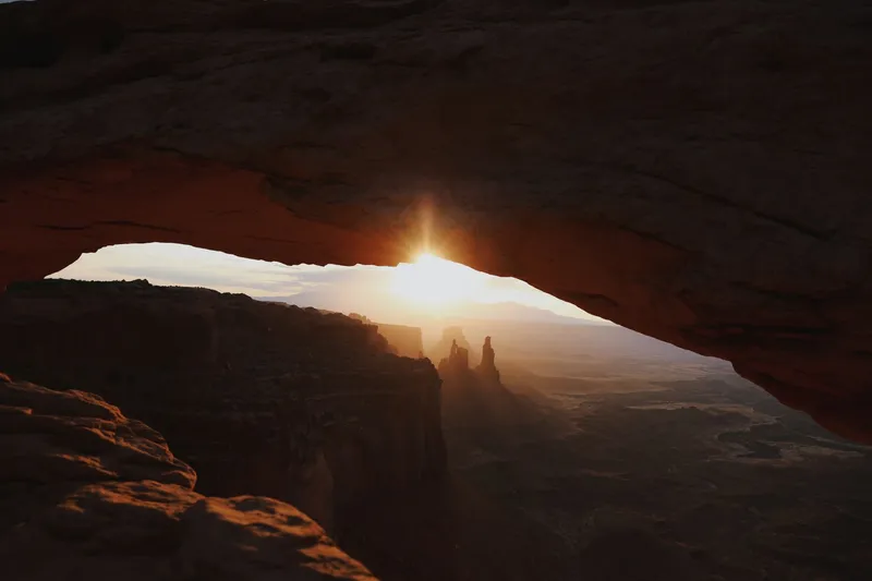 Moab (Arches & Canyonlands): Stunning sunrise view through Mesa Arch in Canyonlands National Park, Utah.