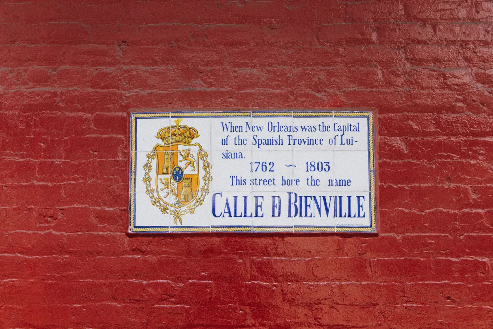 New Orleans: Street sign on a red brick wall, New Orleans, Spanish era history.