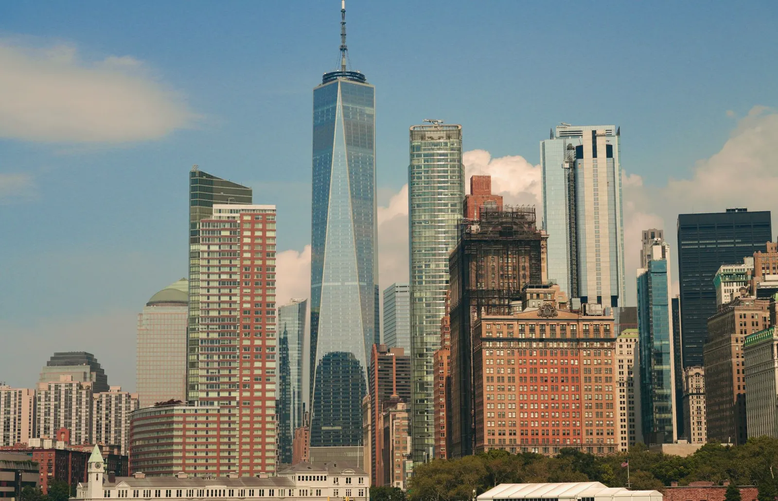 New York City: Impressive cityscape of New York City featuring the iconic One World Trade Center amidst modern skyscrapers.