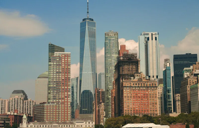 New York City: Impressive cityscape of New York City featuring the iconic One World Trade Center amidst modern skyscrapers.