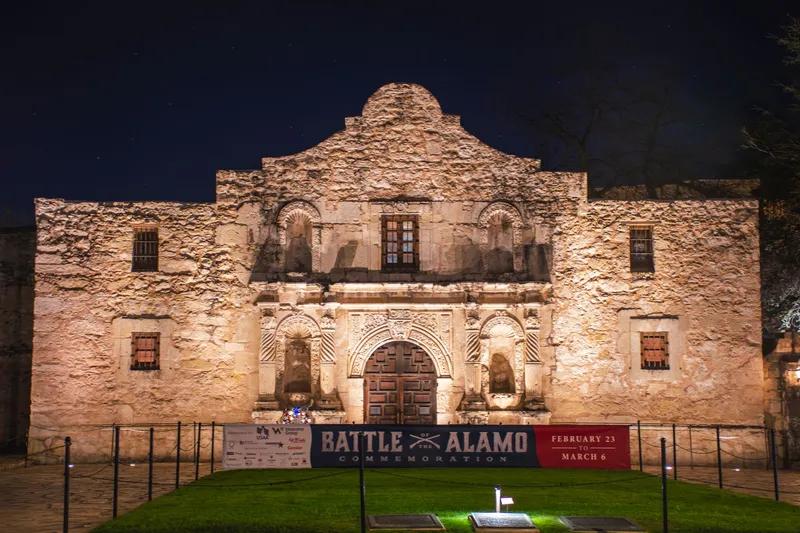 San Antonio: Stunning night view of the Alamo Mission in San Antonio, Texas, beautifully illuminated.
