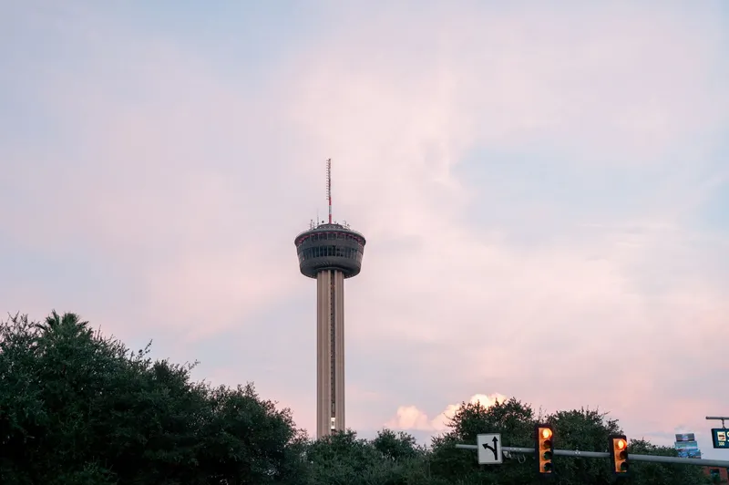 San Antonio: The Tower of the Americas in San Antonio stands tall against a pastel sky at dusk.