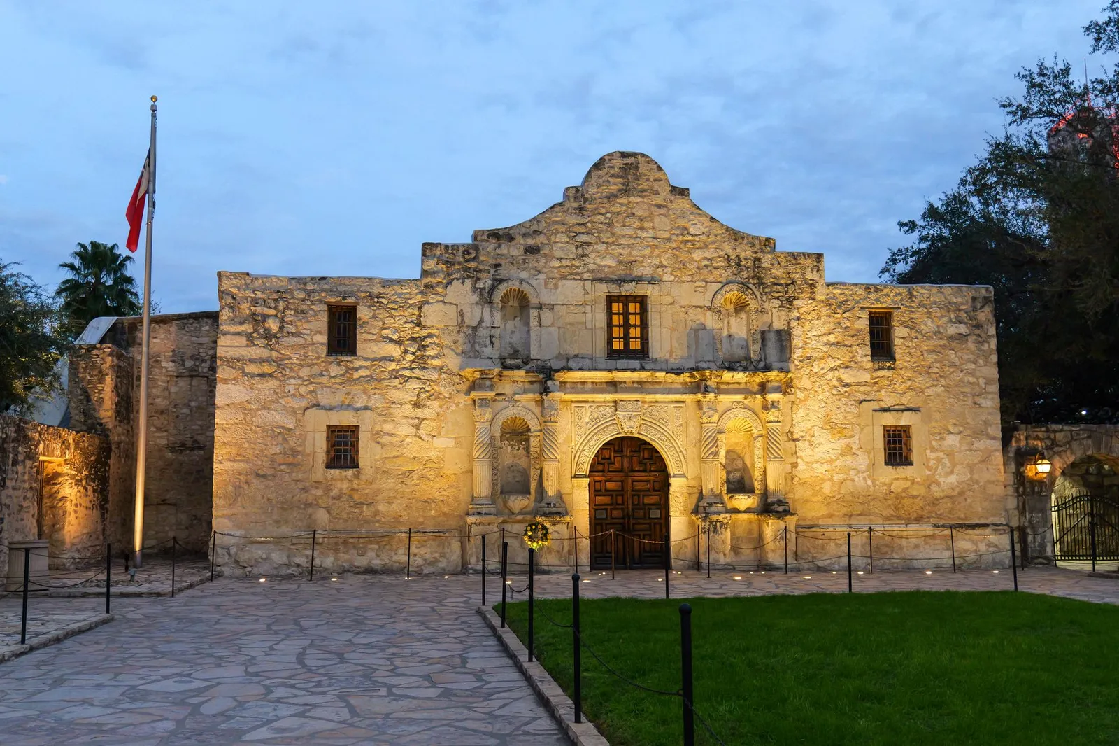 San Antonio: The historic Alamo in San Antonio, Texas, beautifully lit at dusk, showcasing its iconic architecture.