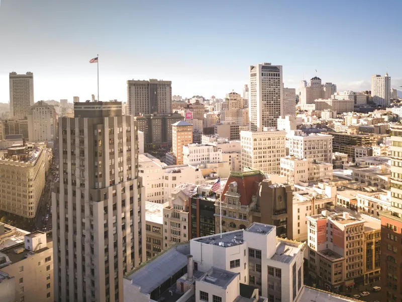 Aerial view of San Francisco's downtown skyline on a clear day, showcasing iconic architecture.