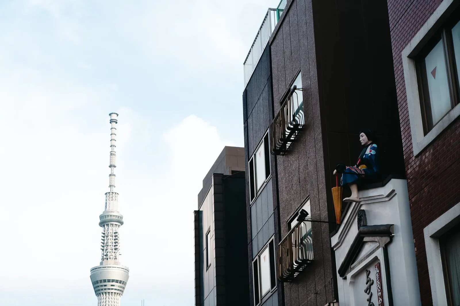 Tokyo: View of Tokyo Skytree beside traditional urban architecture in Tokyo, Japan.