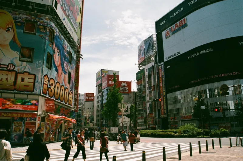 Tokyo: Bustling urban street in Shinjuku, Tokyo showcasing Japanese culture and vibrant billboards.