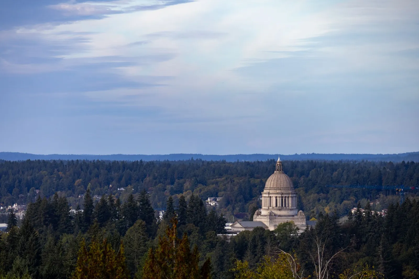 Washington, D.C.: View of Washington State Capitol amidst lush forests in Olympia, Washington.